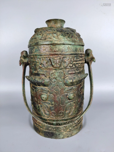 Shang and Zhou bronze pot with animal face and beam