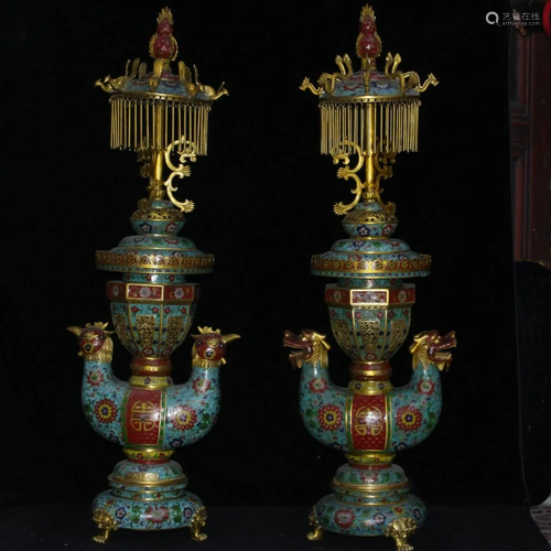 A pair of brass dragon and phoenix lamps made during