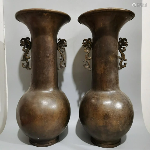 A pair of two-eared bronze vases from the Qianlong