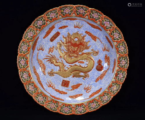 A gilt enamel-carved gilt plate with dragon designs in