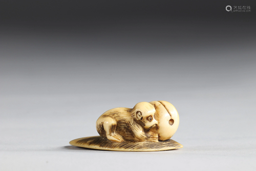 Netsuke carved - a monkey - a fruit. Japan Meiji 19th