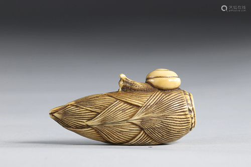 Netsuke carved - an ear surmounted by a snail. Japan