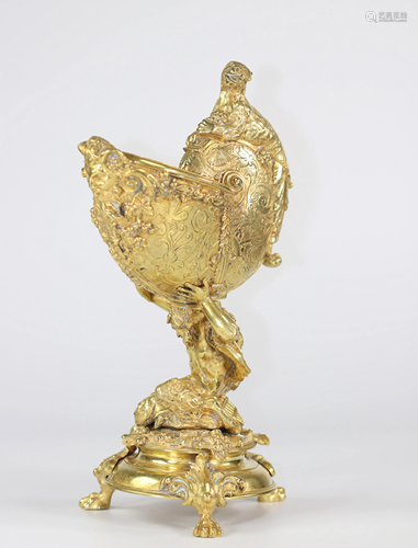 Nautilus in chiseled and gilded bronze carried by a