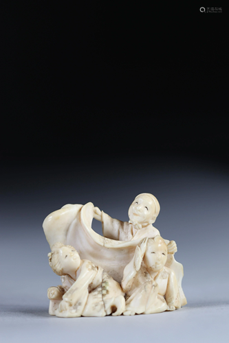 Netsuke carved from a group - figures. Japan Meiji