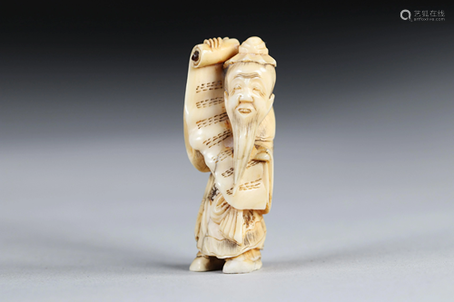 Netsuke carved - a sage carrying a sheet music. Japan