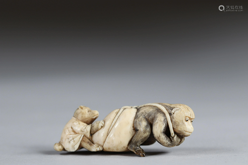 Netsuke carved - a monkey pulling a bag and a teddy