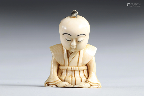 Netsuke carved - a seated figure. Japan Meiji 19th