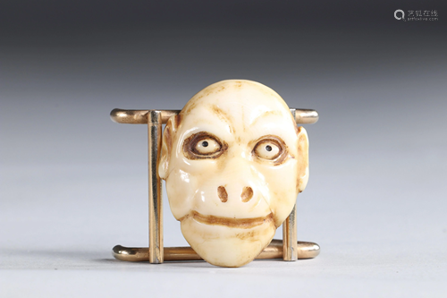 Netsuke carved - a monkey mask, Japan Meiji period 19th