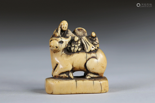 Netsuke carved - figures on a buffalo. Japan Edo period