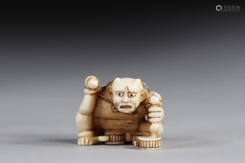 Netsuke / Okimono carved - a seated demon. Japan early