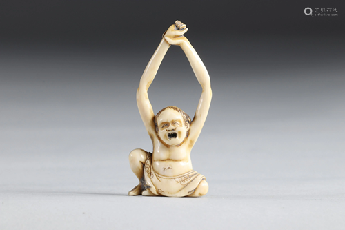 Netsuke carved - a cartoon character. Japan Meiji 19th