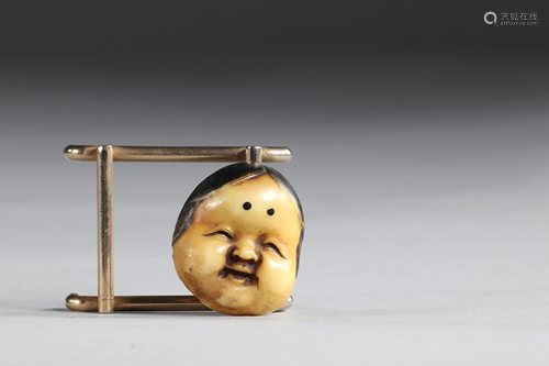 Netsuke carved - a mask. Japan Meiji 19th century