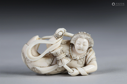 Netsuke carved - a young female musician. Japan Meiji