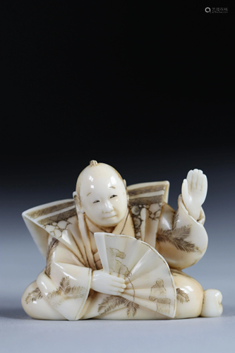 Netsuke carved - a character - a fan. Japan Meiji