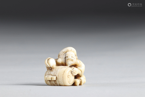 Netsuke carved - a character from a barrel. Japan Meiji