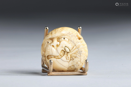 Netsuke Manju circular carved - a monkey. Japan Meiji