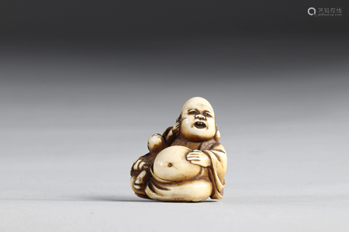 Netsuke carved - a Buddha and a child pulling his ear.