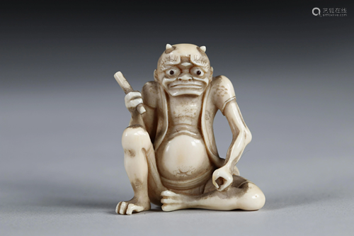 Netsuke carved - a seated Oni. Japan d