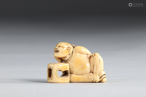 Netsuke carved - a figure leaning on a stool. Japan,