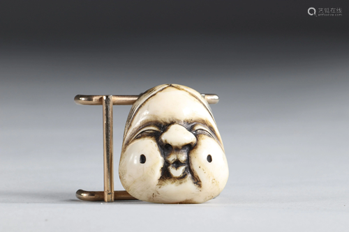 Netsuke carved - a cartoonish mask. Japan Meiji 19th