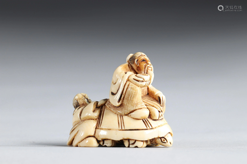 Netsuke carved - figures riding a turtle. Japan Meiji