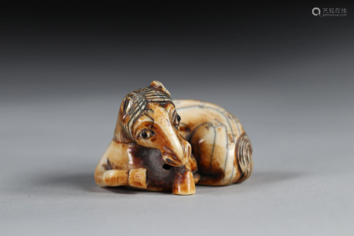 Netsuke carved - a recumbent horse. Japan Edo period