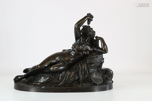 Imposing bronze, reclining Bacchante eating a bunch of