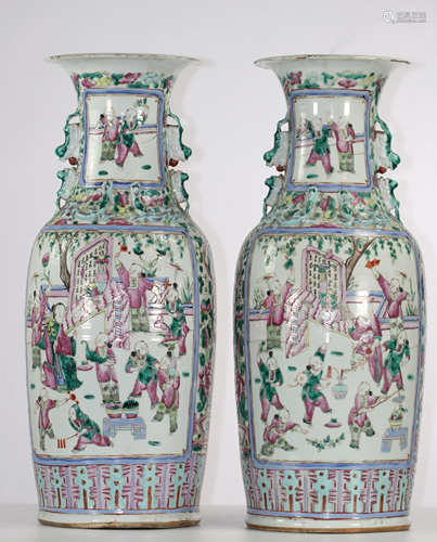 Pair of porcelain vases with character decoration,