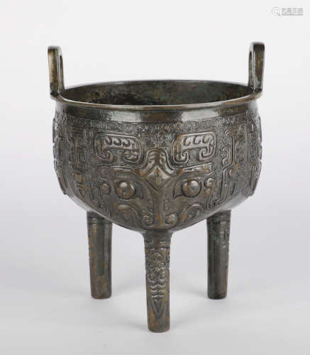 Shang Dynasty - Bronze Tripod with Animal Face Pattern