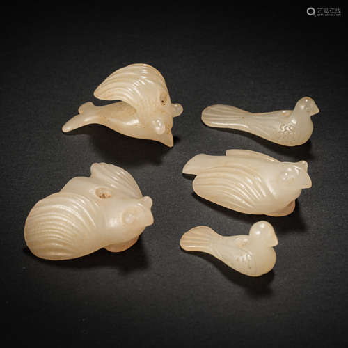 A GROUP OF HETIAN JADE BIRDS, THE WESTERN ZHOU DYNASTY IN CH...