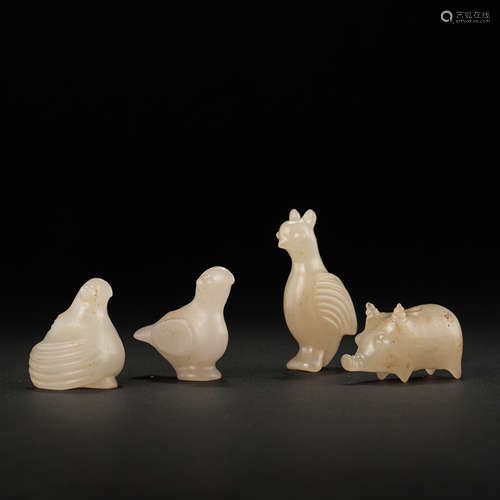 A GROUP OF HETIAN JADE BIRDS, THE WESTERN ZHOU DYNASTY IN CH...