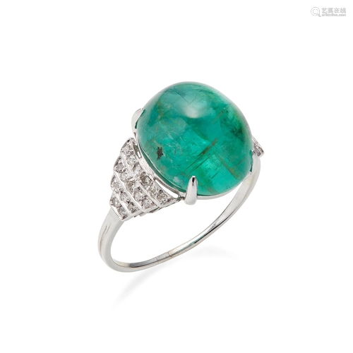 An emerald and diamond set ring