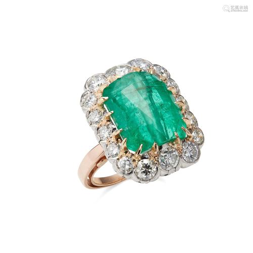 An emerald and diamond set cluster ring