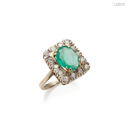 An emerald and diamond set ring