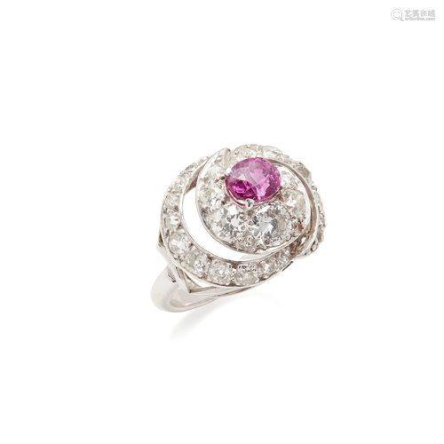 A pink sapphire and diamond set ring