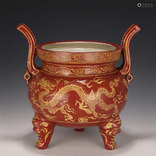 A CHINESE RED GLAZED PORCELAIN TRIPOD CENSER