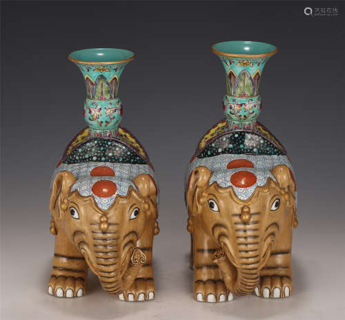 A PAIR OF CHINESE FAMILLE ROSE PORCELAIN ELEPHANT CANDLE HOL...