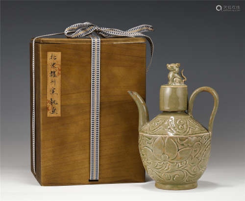 A CHINESE YAOZHOU TYPE GLAZED PORCELAIN HANDLED EWER