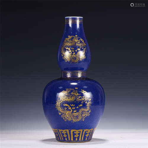 A CHINESE BLUE GLAZED GOLD PAINTED DOUBLE GOURD VASE