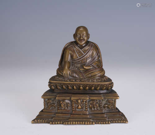 A CHINESE COPPER ALLOY FIGURE OF BUDDHA SEATED STATUE