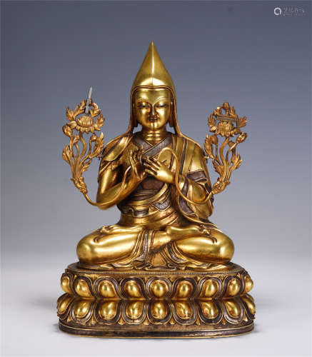 A CHINESE GILT BRONZE INLAID SILVER FIGURE OF BUDDHA SEATED ...