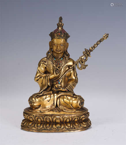 A CHINESE GILT BRONZE FIGURE OF BUDDHA SEATED STATUE