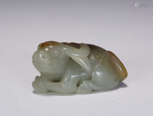 A CHINESE LIGHT GREENISH WHITE JADE FOO-DOG PAPER WEIGHT