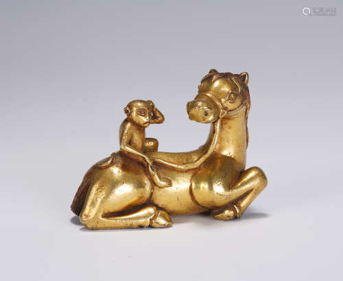 A CHINESE GILT BRONZE HORSE MONKEY PAPER WEIGHT
