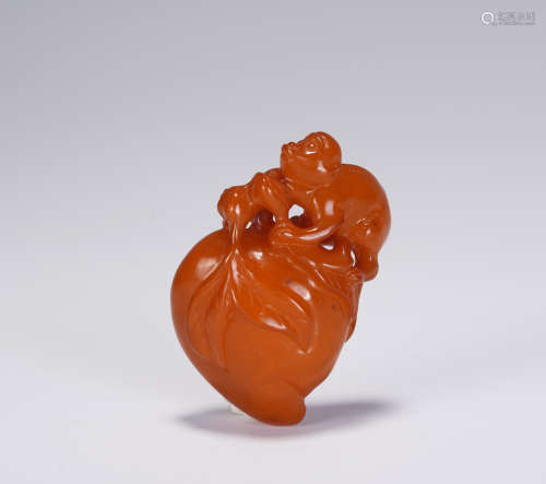 A CHINESE AMBER PEACH PENDANT