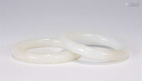 A PAIR OF CHINESE WHITE JADE BRACELETS