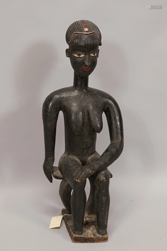 AFRICAN CARVED WOOD WITH PIGMENT, SEATED FIGURE