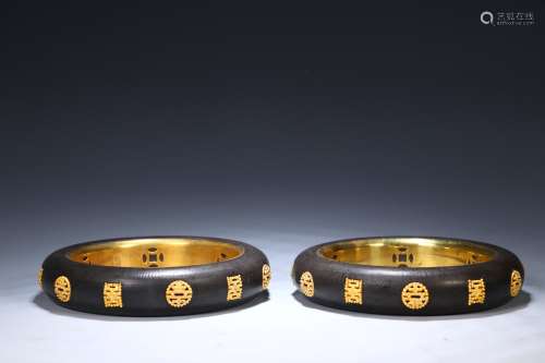 A Pair of Gilt Eaglewood Bracelets