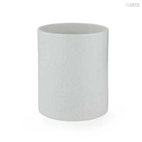 WHITE-GLAZED 'LOTUS' BRUSH POT QING DYNASTY, 18TH-19TH