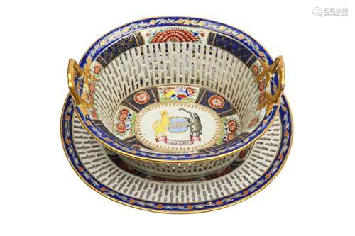 A CHINESE FAMILLE ROSE ARMORIAL RETICULATED BASKET AND STAND...